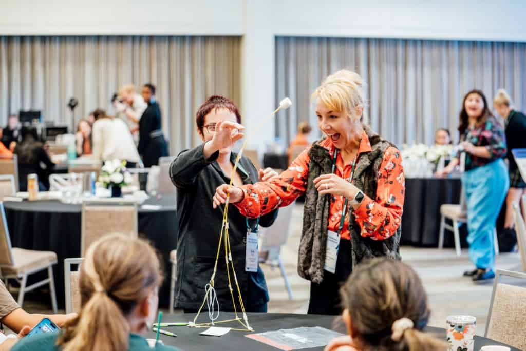 Convening with LPHI where the groups are working on the team building marshmallow challenge.